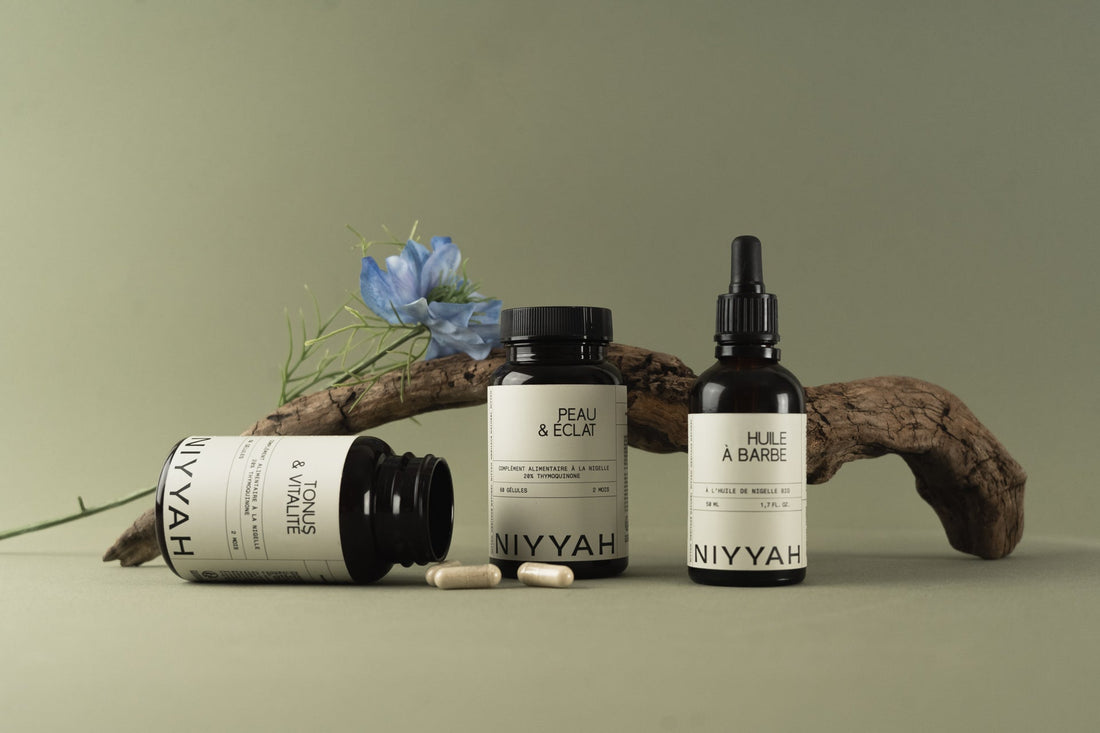 Produits NIYYAH : huile à barbe et compléments à la nigelle sur fond naturel